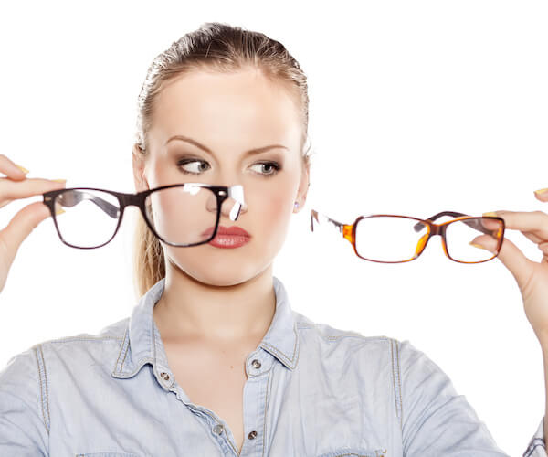 woman comparing glasses