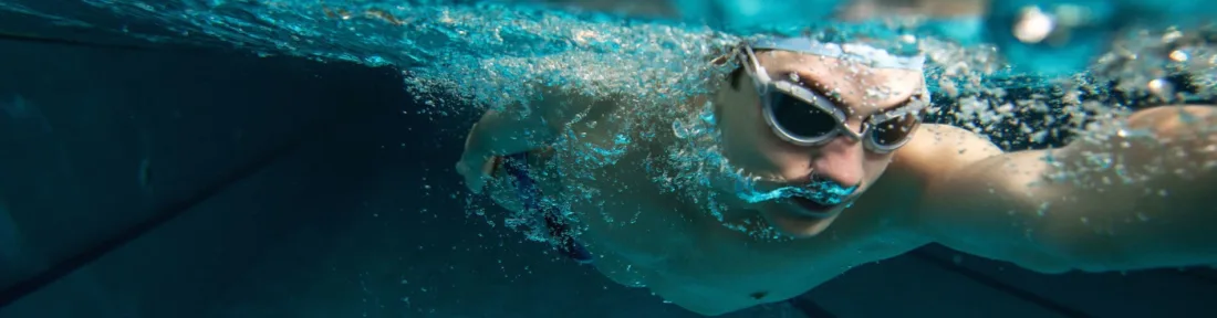 Swimmer wearing protective swimming goggles