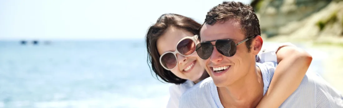 Two people wearing sunglasses outdoors